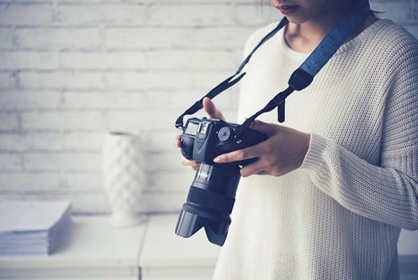 woman using a dslr camera