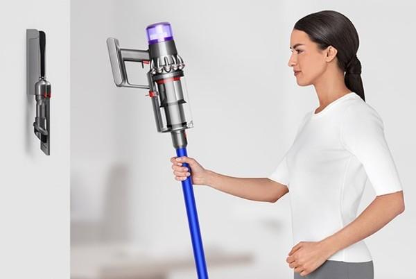 woman with dyson vacuum cleaner