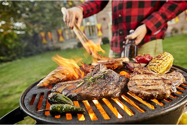 barbecue meat and vegetables on a grill