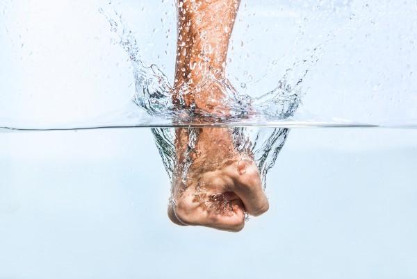 fist punching water