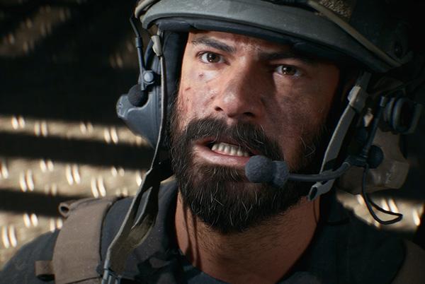 a man in a helmet with a beard and a headset