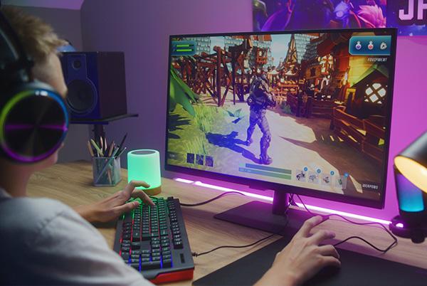 Man playing shooting game gaming monitor