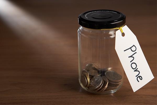 Jar of pennies with phone label
