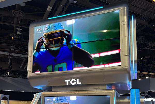 a large tcl tv with a football player on it at ces 2025