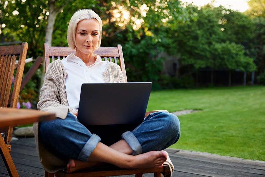 Women enjoying fast wifi in garden