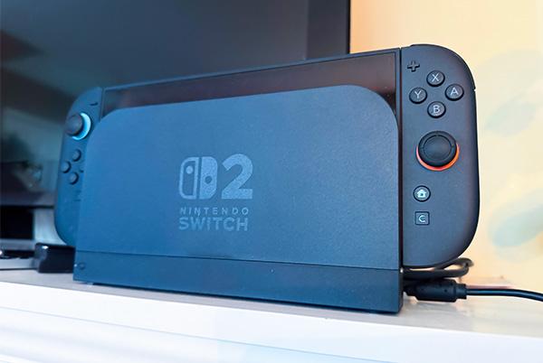 a nintendo switch 2 game console sitting on a shelf next to a tv