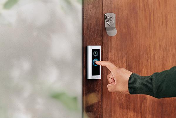 a person is using a ring pro 2 smart doorbell