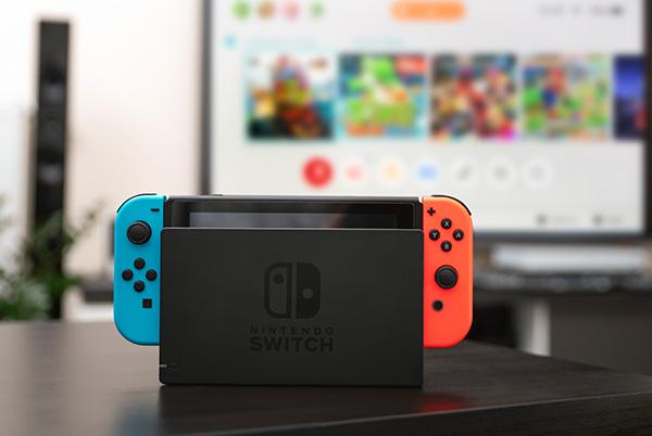 a nintendo switch console in its dock sitting on top of a table