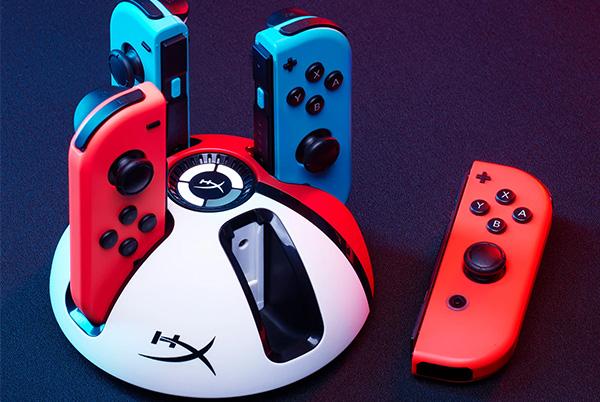 a group of four nintendo switch joy-con controllers in charging dock