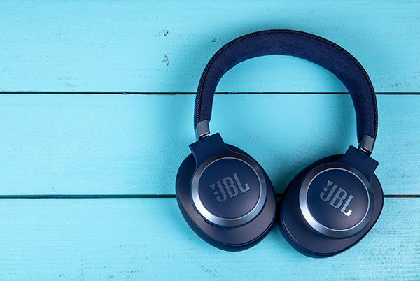 jbl headphones on a blue wooden surface
