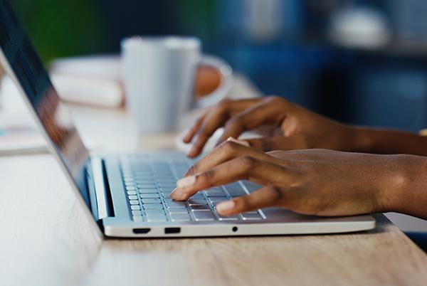Woman typing keyboard laptop