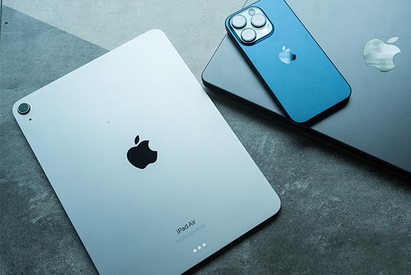 a close up of an iphone and ipad on a table