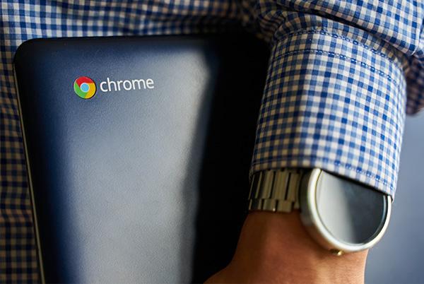Chromebook laptop under arm watch