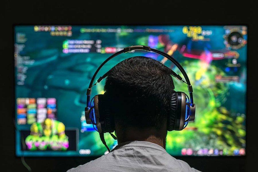 Men Playing game in front on monitor