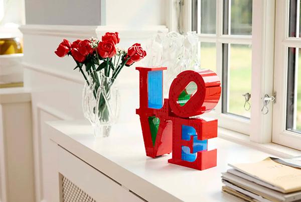 a lego art love set on a window sill
