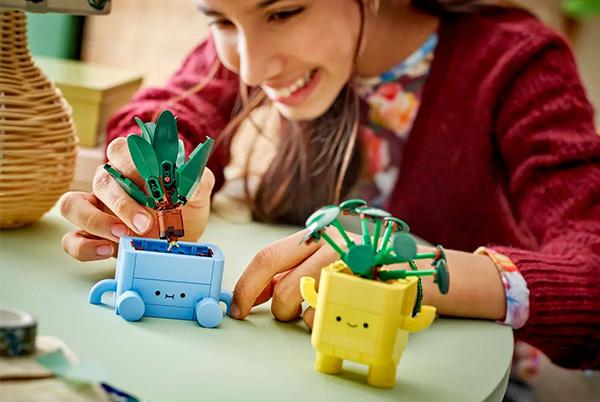 a child playing with lego botanicals happy plants
