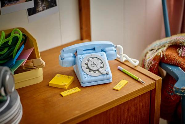 a small wooden desk with a lego creator 3-in-1 retro telephone lego