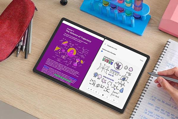 a lenovo idea tab pro on a desk with a stylus hovering over it
