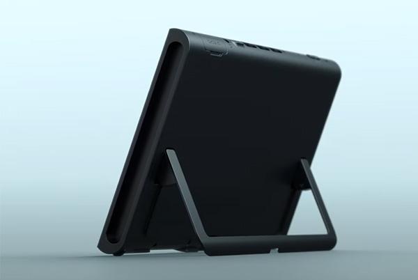 a nintendo switch 2 sitting on a kickstand on a blue background