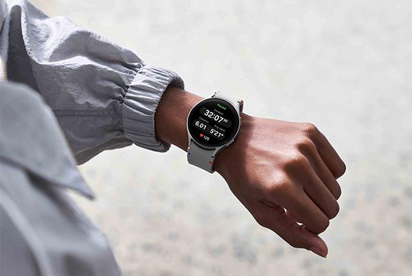 a person wearing a samsung galaxy watch 7 on their wrist