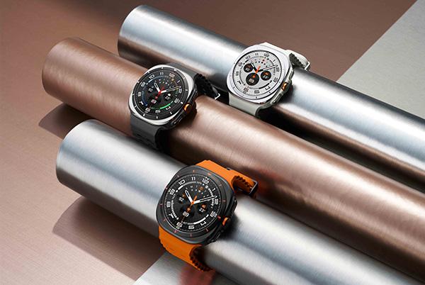 three samsung galaxy watch ultra smart watches are lined up on metal pipes