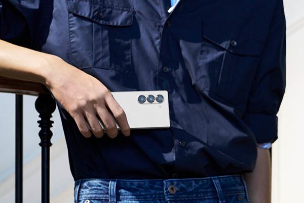 man holding samsung galaxy z fold6 phone in one hand in folded mode