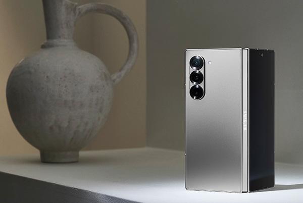 samsung galaxy z fold6 phone in silver shadow colour on side table with vase