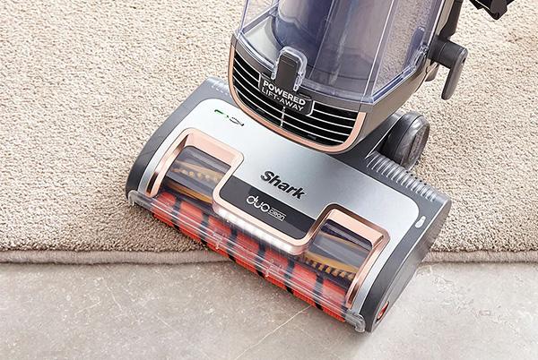 a close up of a shark vacuum cleaner duoclean floorhead on a carpet