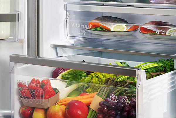 a refrigerator with a lot of food in it and a lot of vegetables