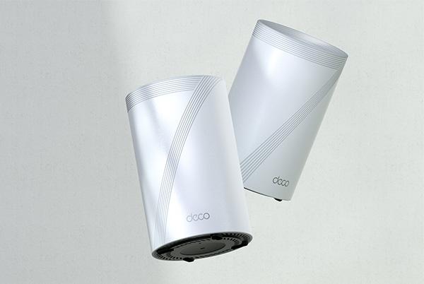 two white tp link deco units floating together on white textured background