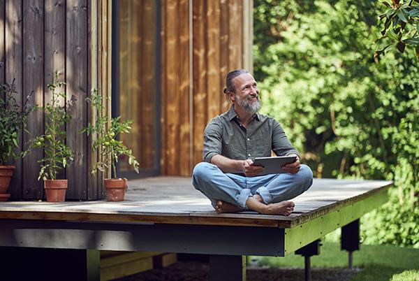 tiny house tablet man outside decking