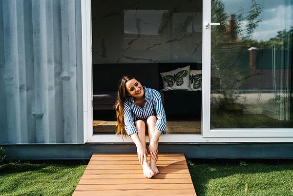tiny house woman door decking