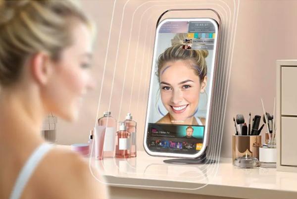 a woman is looking at her phone in front of a mirror
