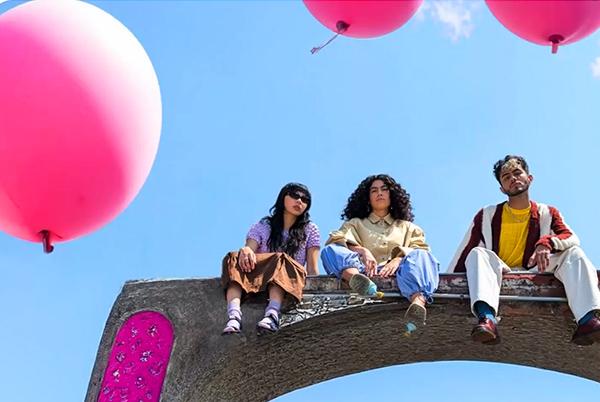 A picture with people and balloons taken on a Pixel 9 phone.