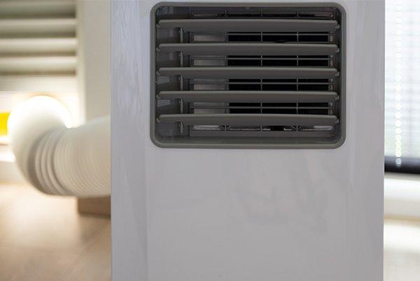a close up of a small air conditioner sitting on a table
