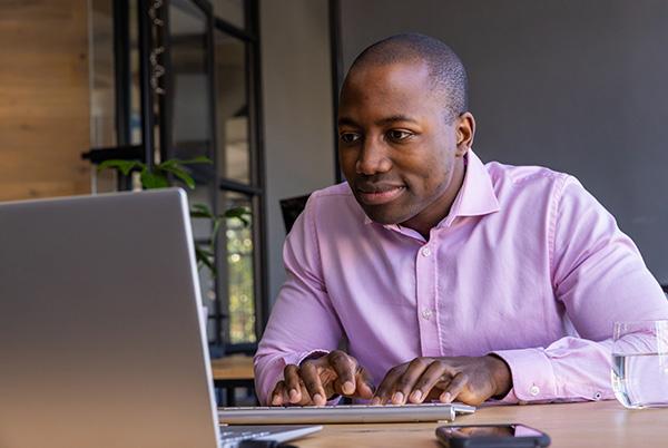 a man using a wireless keyboard