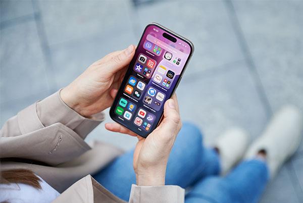 a woman holding a cell phone in her hands