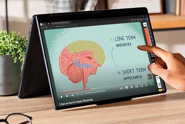 a person is using a laptop with google on it