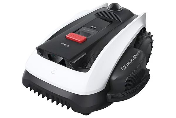 a black and white vacuum cleaner with a red button