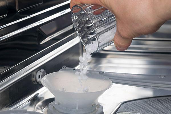 dishwasher hand holding clean glass