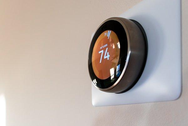 a smart thermostat on a wall 