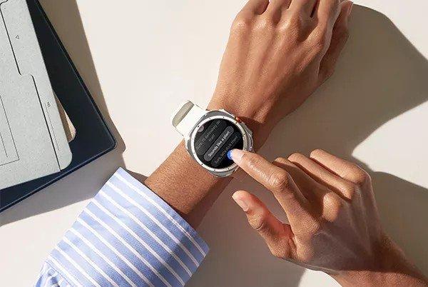a person is using a smart watch to check the time