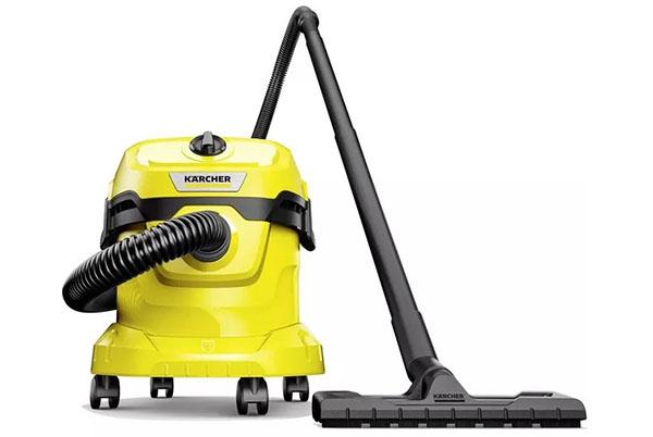 a yellow and black karcher vacuum cleaner sitting on a white surface