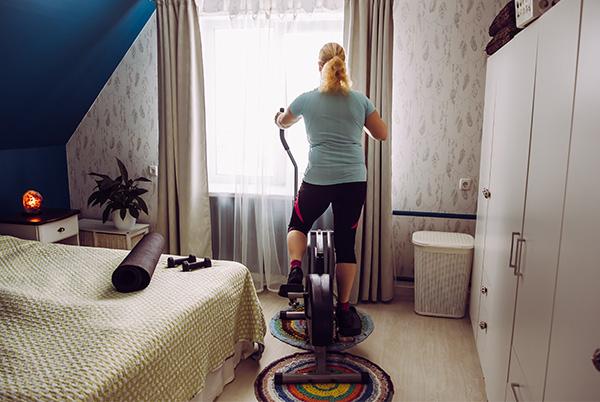 Bedroom gym woman elliptical