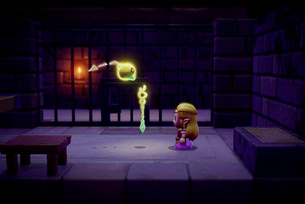 screenshot from legend of zelda echoes of wisdom game showing princess zelda and tri the fairy with tri rod in dark room