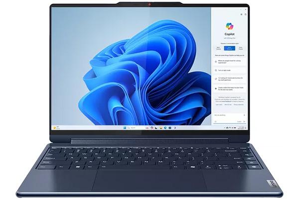 a lenovo yoga 9 2 in 1 laptop with a blue flower on the screen