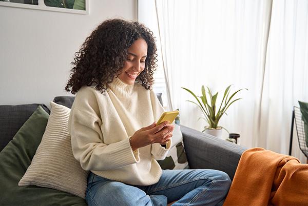 Woman on phone sofa