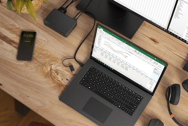 MacBook on desk with docking station