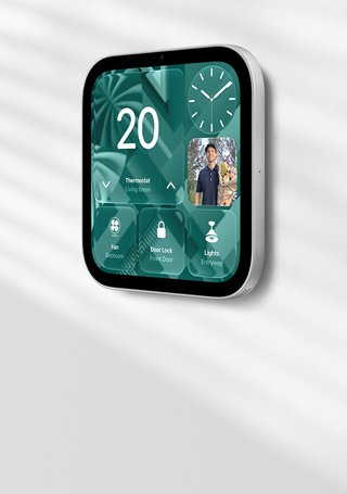 Apple HomeView wall-mounted model on a wall, silver colour, displaying time, temperature, and controls for thermostat, bedroom fan, door lock and lights