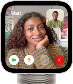 Apple HomeView, starlight (pale gold) colour, front exterior, showing a FaceTime video call screen displaying one person in the main view and another person in an inset window, with control buttons at bottom of screen